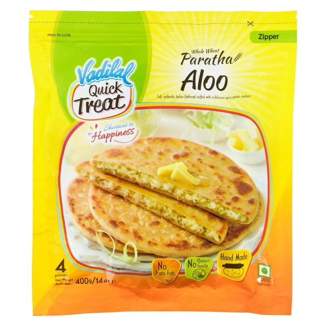 Vadilal Aloo Paratha package showing whole wheat Indian flatbread stuffed with spicy potato filling, with two parathas on a plate topped with butter, indicating 4 pieces weighing 400g (14 oz), featuring no trans fats, no onion or garlic, and handmade labels.