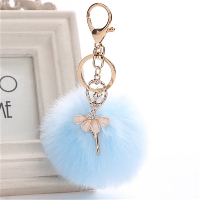 EGNMCR Keychains 8CM Cute Dancing Angel Keychain Pendant featuring a gold alloy clasp, a delicate angel charm with rhinestone accents, and a soft blue artificial rabbit pompom. Ideal for use as a keychain, travel accessory, bag pendant, or car accessory.