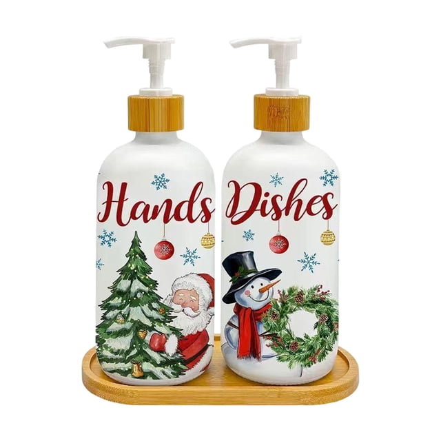 Snowman Tree Glass Pump Bottles Christmas Soap Dispenser Set for Kitchen Bathroom Decor. This 2-pack set includes two white glass pump bottles with festive designs featuring Santa Claus with a Christmas tree and a snowman with a wreath. Each bottle is labeled 'Hands' and 'Dishes' in red script, surrounded by snowflakes and ornaments. The set comes with a coordinating bamboo tray for stability and organization, ideal for countertops in kitchens or bathrooms. Suitable for dispensing hand soap, lotion, or dish soap, this durable and reusable set adds a cheerful holiday touch to your decor.