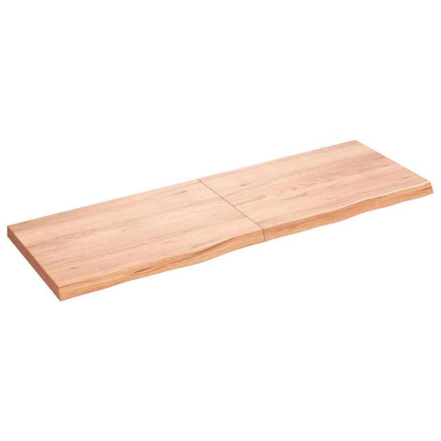 vidaXL Table Top Light Brown 180x60x(2-6) cm made of treated solid oak wood with a varnish finish. The tabletop features a live edge on one long side, showcasing its natural charm. It measures 180 cm in length, 60 cm in width, and has a thickness ranging from 2 to 6 cm. The surface is treated and ready for use, suitable for home or commercial settings. The foldable hinge design allows for easy storage in narrow spaces.