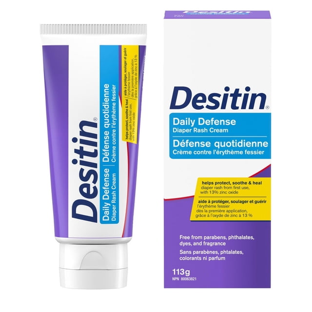 Desitin Daily Defense Baby Diaper Rash Cream with 13% zinc oxide in a 113g purple and white tube alongside its box, featuring bilingual English and French text highlighting its hypoallergenic, paraben-, phthalate-, dye-, and fragrance-free formula that soothes, treats, and prevents diaper rash by forming a protective barrier on baby's skin.
