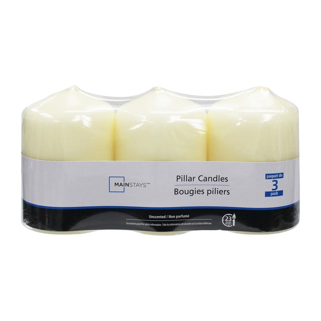 Mainstays Unscented 3PK Ivory Pillar Candles with three smooth ivory wax pillars, each 2.8 inches diameter by 4 inches height, featuring cotton wicks and packaged in clear plastic wrap with a white and black label, ideal for indoor Christmas decorations and creating warm, ambient lighting.