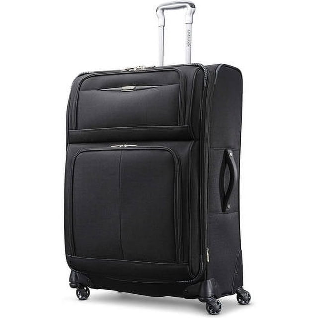 American Tourister Meridian NXT Expandable Large Spinner Luggage in black durable 1200 x 900 denier polyester with four dual spinner wheels, ergonomic push-button telescoping handle, multiple zippered pockets, side and top carry handles, and expandable capacity for organized checked travel.