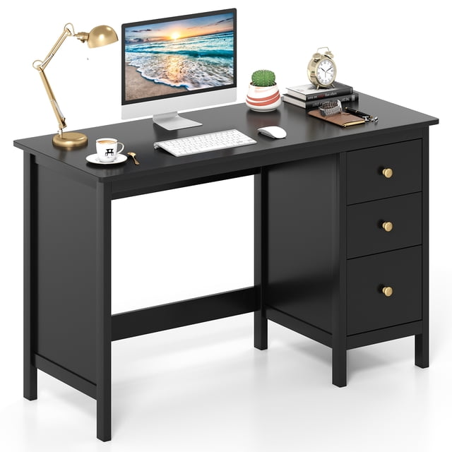 Patiojoy Computer Desk with 3 drawers, featuring a 48-inch wide black tabletop and a modern design. The desk includes three pull-out drawers with gold metal knobs for organized storage and a spacious legroom area. Made of durable MDF with thickened boards for stability, it comes with an anti-tip kit for added safety. The desk is shown in a clean, minimalistic setting with a computer monitor, lamp, books, and decor items on the surface.