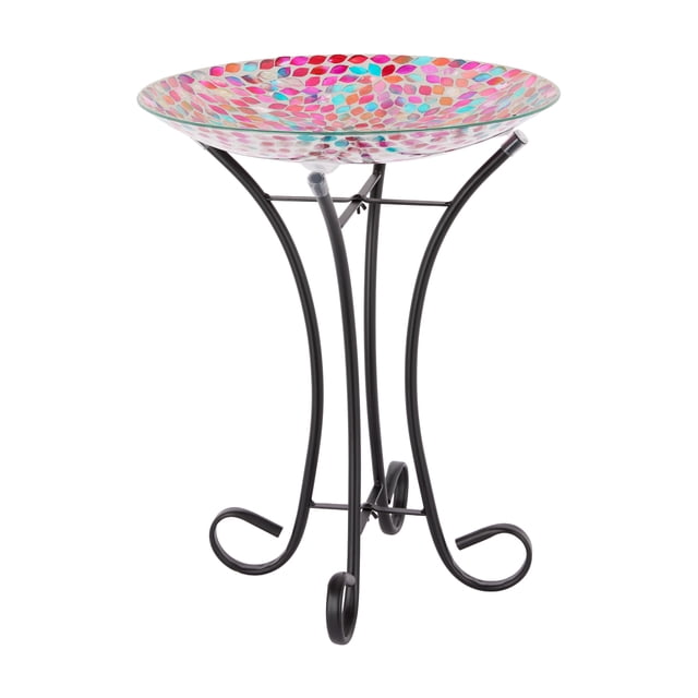 Mainstays Mosaic Pink Petals Glass Birdbath with a 16.3-inch wide glass bowl decorated in pink and turquoise petal mosaic pattern, supported by a black iron stand with curved legs, suitable for garden or patio outdoor use.