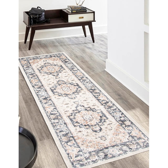 ECARPET Heriza Traditional Runner Rug for Living Room, Bedroom, Dining Room, Entrance, Hallway and More, a rectangular runner woven in Turkey with a traditional geometric medallion pattern in beige, gray, and soft orange hues, placed on light wood flooring beside a dark wood mid-century modern console table with a drawer and books on top, suitable for high-traffic areas.