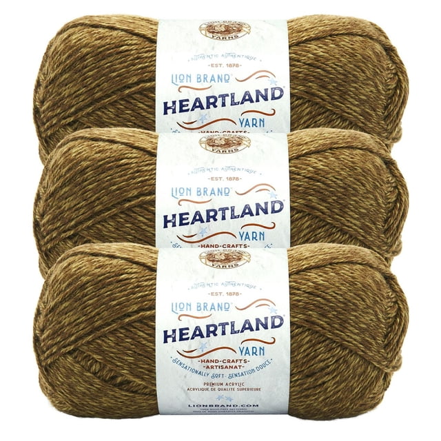 Lion Brand Yarn Heartland Yarn 3Pack showing three skeins of medium worsted weight acrylic yarn in a heathered brown shade with white branded labels. This machine-washable yarn is suitable for knitting, crochet, and often used for durable home décor crafts.