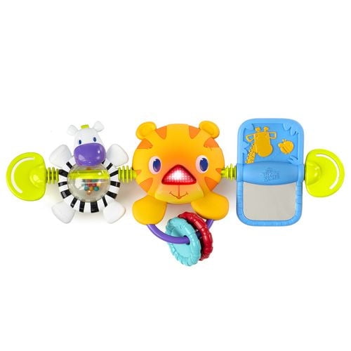 Bright Starts Take Along Carrier Toy Bar with a central orange tiger featuring a baby-activated light-up nose and attached textured rings, a spinning zebra roller ball with colorful beads on one side, and a blue paddle mirror with giraffe illustrations on the other, connected by yellow spring arms and green clips for easy attachment to infant carriers.