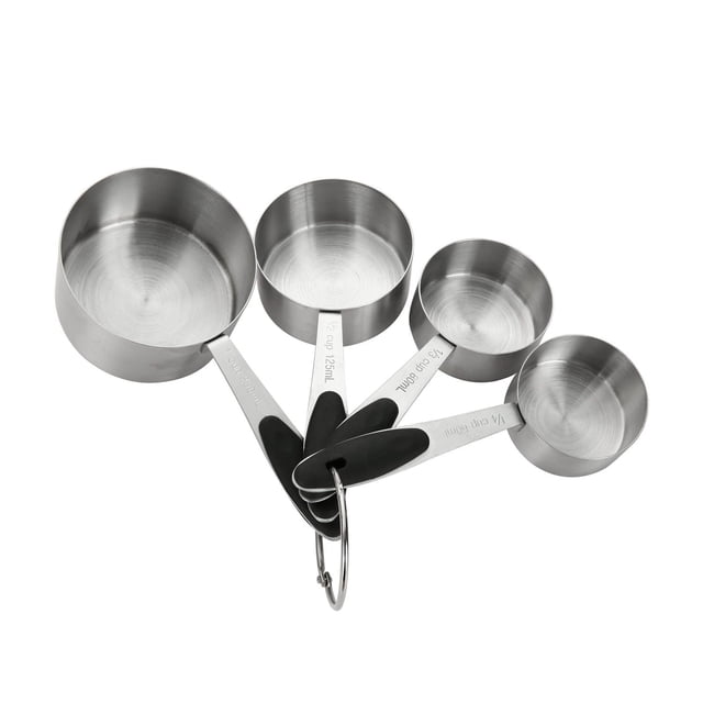 Mainstays 4-Piece Stainless Steel Measuring Cups with easy grip black handles and engraved US and metric measurements, including 1 cup, 1/2 cup, 1/3 cup, and 1/4 cup sizes, nested together with a metal ring for compact kitchen storage, made of durable stain-resistant stainless steel.