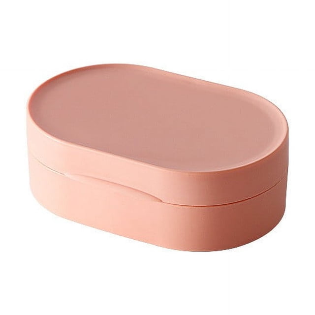 EGNMCR Travel Soap Box With Lid Mini Portable Soap Box made of silicone, shown in a compact oval design with a soft pink color. The soap box features a secure, leak-proof lid and a sleek, modern appearance. Ideal for travel, outdoor activities, or versatile storage of small items like jewelry or earphones.