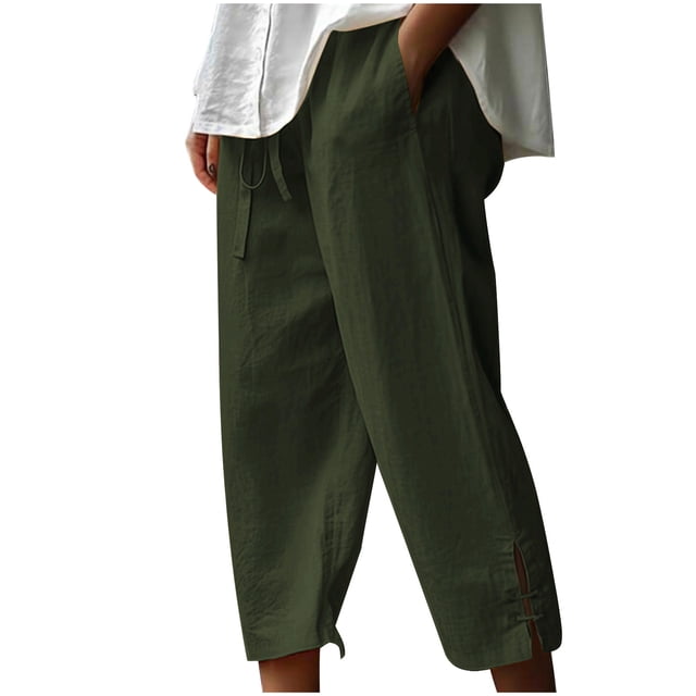 Timegard Women's Cotton Linen Pants with an elastic waistband and drawstring, shown in a casual loose fit capri style with side pockets. The pants are displayed in a dark green color, featuring a cropped length with subtle side slits near the hem. Ideal for casual outings or lounging, these trousers are crafted for comfort and breathability.