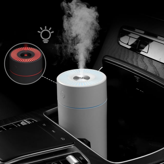 Portable Mini Humidifier for Bedroom, Office & Nursery - 320ml Cool Mist Humidifier in white, positioned in a car cup holder. Features include two spray modes, auto shut-off, quiet operation (<18dB), and a color LED night light. Compact and travel-friendly design, ideal for bedrooms, offices, and cars, with dimensions of 14x8x8cm.