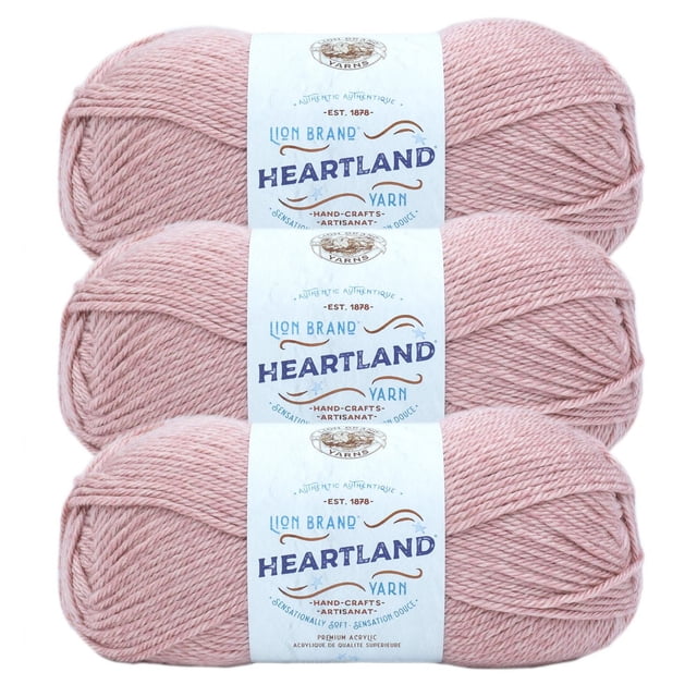 Lion Brand Yarn Heartland Yarn 3Pack in soft pink, three skeins of worsted weight acrylic yarn with white labels showing brand and product details, machine washable and ideal for knitting or crochet crafts.