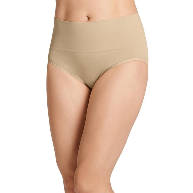 Jockey Essentials 2-Pack Tummy Smoothing Seamfree® Brief in beige shown on a model from waist to mid-thigh, featuring a high-rise waistband and smooth, stretchy microfiber fabric that comfortably slims the tummy with a seamless design, perfect for everyday wear under skirts, dresses, and pants.