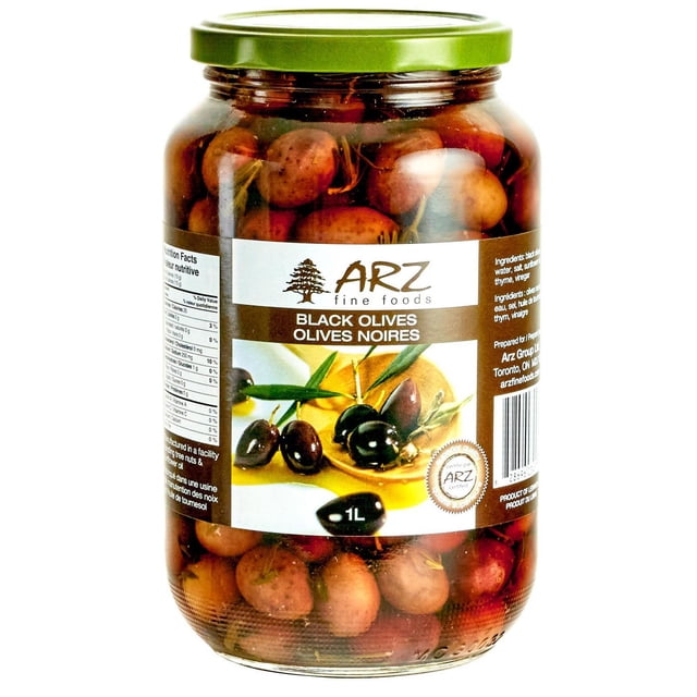 Arz Black Olives in a 1-liter clear glass jar with a green lid, filled with whole black olives in brine, featuring a bilingual label with Arz Fine Foods branding, ideal for Mediterranean dishes, salads, sandwiches, or pizza.