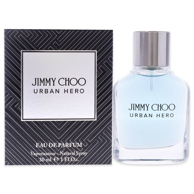 Urban Hero by Jimmy Choo for Men - 1.0 oz EDP Spray, a woody-aromatic designer fragrance with notes of citrus, black pepper, rosewood, and grey amber. The bottle features light blue liquid, a textured silver cap, and is paired with geometric black and silver packaging, ideal for gifting or personal use.