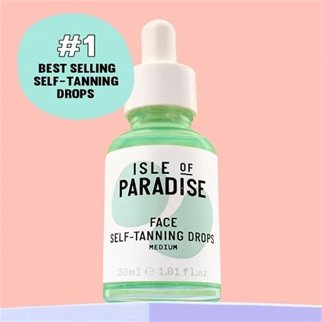 Self Tanning Drops - Color Self Tan Drops For Gradual Glow, Vegan And Free, 1.01 Fl Oz/30ml. A green-tinted glass bottle with a white dropper cap, labeled 'Isle of Paradise Face Self-Tanning Drops Medium.' Designed for mixing with moisturizers to create a custom, even tan. Infused with natural ingredients like grapefruit, chia seed, and avocado for hydration and a long-lasting glow. The bottle is displayed against a pastel pink background with a text bubble reading '#1 Best Selling Self-Tanning Drops.'