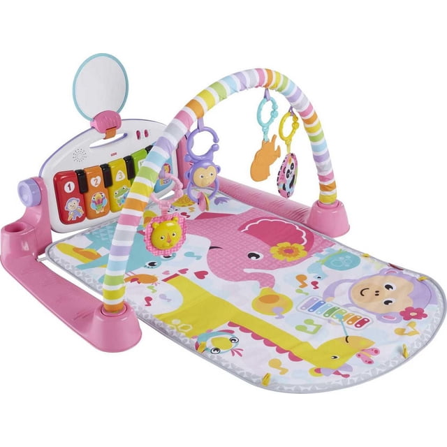 Fisher-Price Deluxe Kick & Play Piano Gym - English Version with a pink frame and colorful play mat featuring animal illustrations including a monkey, elephant, and giraffe. It has a rainbow-striped arch with five hanging toys: lion teether, monkey rattle, orange hand, panda crinkle, and a self-discovery mirror. The back panel includes five numbered light-up piano keys with animal icons and a detachable keyboard for musical play.