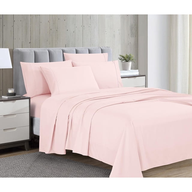 1800 Series Microfiber Sheet Set with Bonus Pillowcases in soft pink, displayed on a bed with a grey upholstered headboard, featuring wrinkle-resistant flat and fitted sheets plus pillowcases in a modern bedroom with light wood panel walls and white curtains.