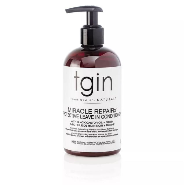 Tgin Miracle Repairx Protective Leave In Conditioner in a 13 oz pump bottle. The product features a sleek design with a dark amber bottle and a black pump dispenser. The label highlights its key ingredients, including black castor oil and biotin, and emphasizes benefits such as reducing breakage, preventing split ends, and promoting healthy hair growth. Suitable for replenishing natural oils and conditioning hair for a soft, smooth, and manageable feel.