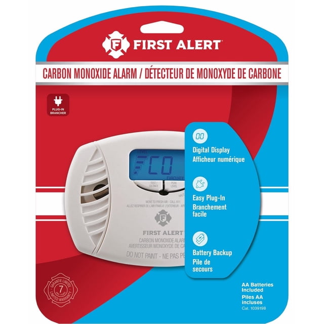 First Alert Dual-Power Plug-In Carbon Monoxide Detector with Battery Backup and Digital Display CO615A in white, shown in retail packaging with red and blue background, featuring a digital display reading 'CO', easy plug-in design, test/silence button, and safety warnings for home carbon monoxide detection.