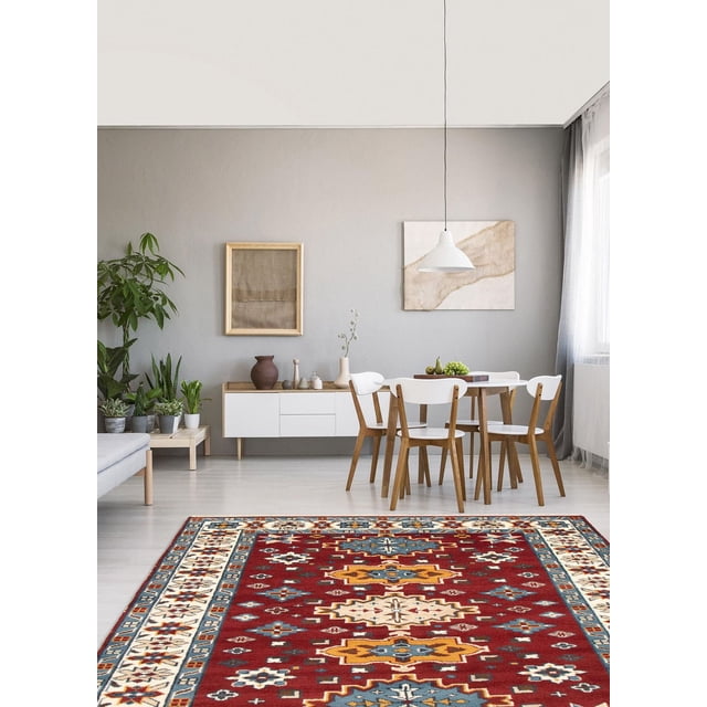 ECARPETGALLERY 100% Wool Traditional Indoor Area Rug with bold geometric Kazak patterns in red, blue, yellow, and cream, displayed in a modern dining room with a wooden table, white chairs, grey walls, minimalist decor, and natural light, ideal for entrance, bedroom, living, or dining rooms.