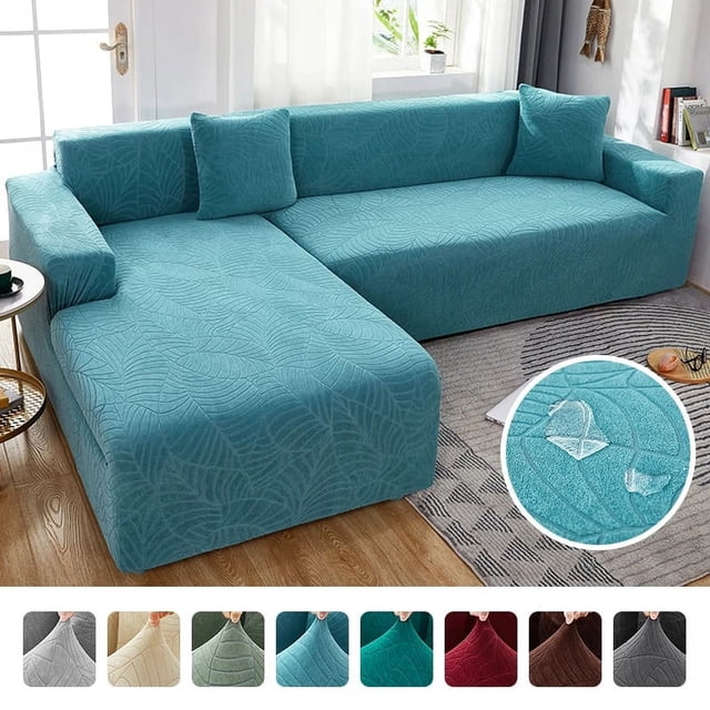 Waterproof Sofa Covers 1/2/3/4 Seats Jacquard Solid Couch Cover L Shaped Sofa Cover Protector Bench Covers shown in a vibrant teal color with a textured jacquard leaf pattern. The cover is displayed on an L-shaped sofa in a modern living room with wooden flooring and a neutral-toned rug. The inset highlights the waterproof feature with a close-up of water droplets on the fabric. Multiple color options are shown at the bottom, including gray, beige, green, teal, red, and brown.