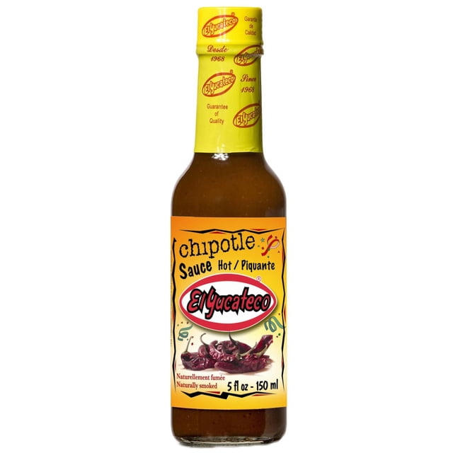 El Yucateco Hot Chipotle Sauce in a 150 mL glass bottle with a yellow cap and label featuring naturally smoked chipotle peppers and bilingual text. Suitable for marinating chicken or as a dipping sauce for shrimp and vegetables.