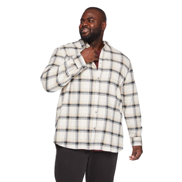 George Big Men's Flannel Shirt in cream with black and beige plaid pattern, featuring long sleeves with button-tab cuffs, pointed collar, full-button front closure, and curved hem, worn over a maroon shirt with black pants for versatile casual layering.