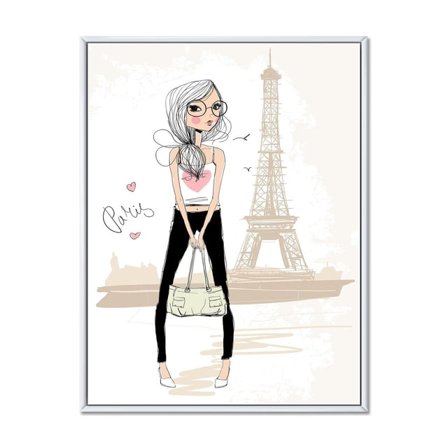Designart Cute Girl By The Tour Eiffel In Paris FLOAT FRAME WALL ART depicting a minimalist illustration of a girl wearing a white tank top with a pink heart, black pants, and white shoes, holding a beige handbag, standing in front of the Eiffel Tower. The gallery-wrapped canvas is stretched over a 1-inch wood subframe and set in a white floating frame, ready to hang for home wall décor.