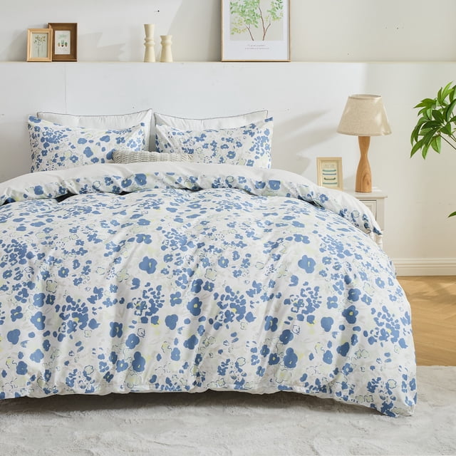 Hitime Queen Duvet Cover Set, a 3-piece bedding set made of soft and breathable microfiber with a blue and white watercolor floral pattern. Includes one duvet cover and two pillowcases, suitable for queen-sized beds. Displayed in a bright, minimalist bedroom with complementary decor, highlighting its stylish and cozy design.