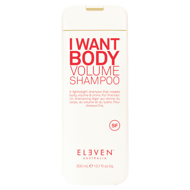 Eleven Australia I Want Body Volume Shampoo 300ml / 10.1 fl oz bottle. The lightweight shampoo is designed to create body, volume, and shine, ideal for fine hair. The bottle features bold red text on a white background with product details in English and French. Vegan-friendly and enriched with soy and wheat proteins.