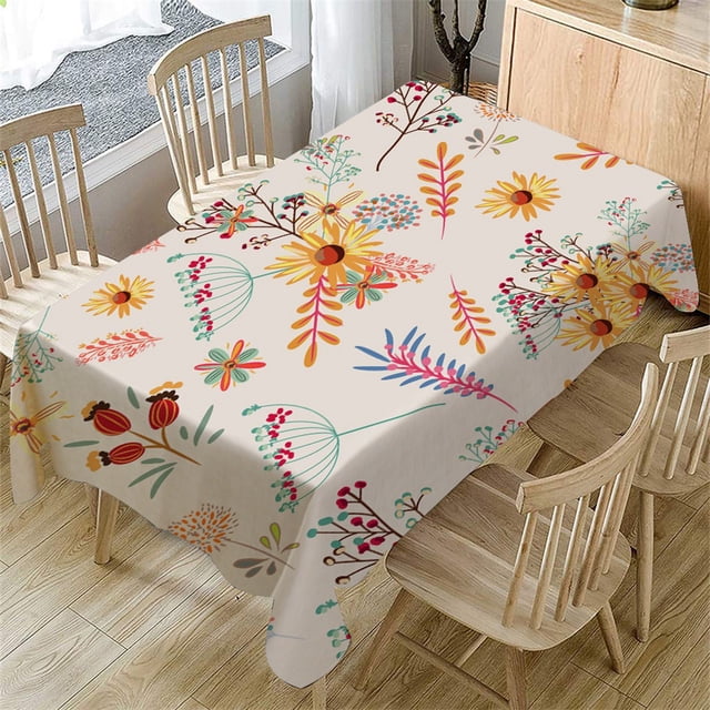 EGNMCR Tablecloths, Table Runner Fresh Flower Pattern Table Cloth Rectangular Tea Table Cover Dining Home Decor Table cover. This rectangular tablecloth features a vibrant fresh flower pattern with yellow, red, and blue floral designs on a light beige background. Made of durable linen material, it is wrinkle-proof, shrink-proof, and lightweight, with fashionable fringe edges for added elegance. Measuring approximately 140cm x 80cm (55" x 31.5"), it is suitable for dining tables, tea tables, or kitchen tables. The tablecloth is easy to care for with fade and wrinkle resistance, making it ideal for daily use or special occasions. Shown in a dining room setting with wooden chairs and a light wood floor.