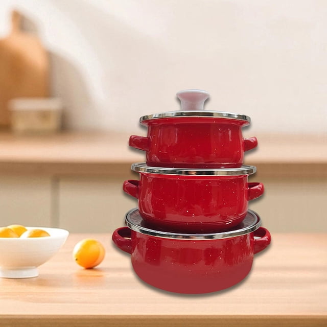 Elodie 3 Pieces Enamel Mini Pot Set in red, featuring three stackable pots with double handles and stainless steel rims. These enamel cookware pieces are lightweight and durable, ideal for cooking milk, soups, baby food, and sauces. Shown on a wooden kitchen countertop with a blurred background.