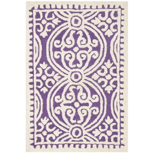 SAFAVIEH Cambridge Leslie Geometric Area Rug with hand-tufted wool construction, plush cut pile, and high/low loop texture in a purple and white geometric pattern, suitable for modern home or office decor.