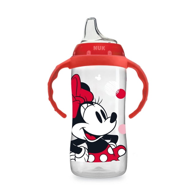 NUK Large Learner Cup, Minnie, 10 oz, clear plastic sippy cup with red removable easy-grip handles and spill-proof soft spout. Features Minnie Mouse graphic with red bow and polka dot dress, air vent to reduce swallowed air, BPA-free and dishwasher safe, recommended for babies 9 months and older.