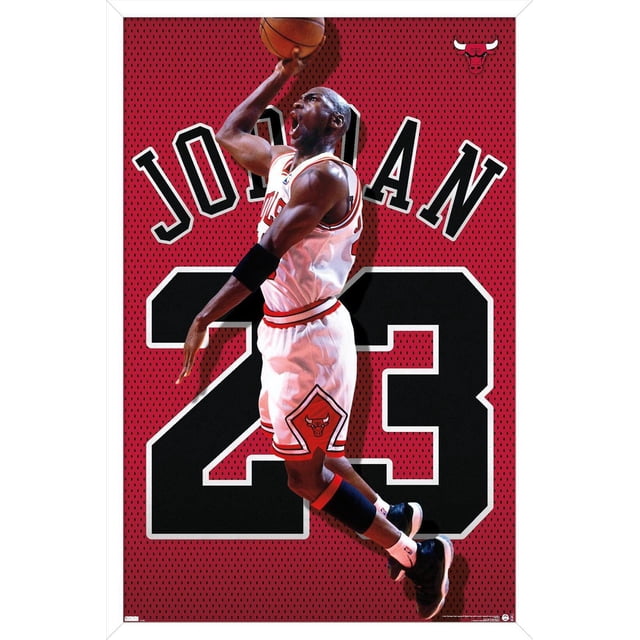 Michael Jordan - Jersey Wall Poster, 22.375" x 34" framed, depicting a basketball player in a white Chicago Bulls uniform with red and black trim jumping mid-air with a basketball, set against a red perforated background with large black number 23 and 'JORDAN' text, featuring Bulls logos on the shorts and upper right corner, suitable for sports-themed wall art and fan rooms.