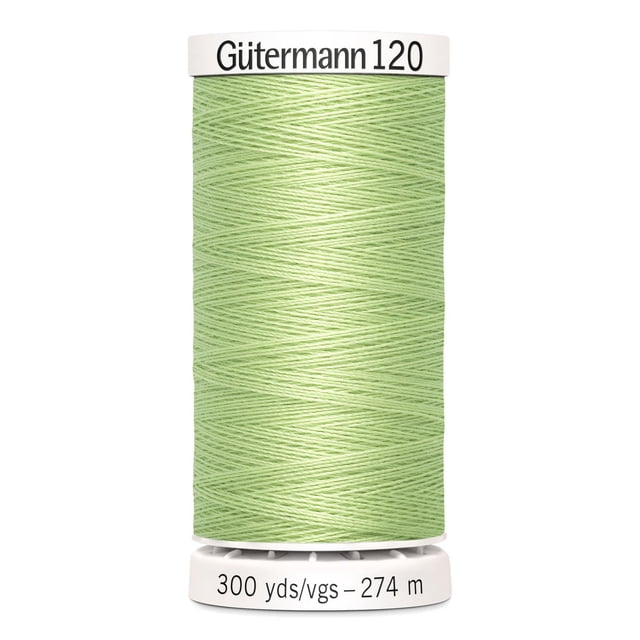 Gutermann 120 100% polyester all purpose sewing thread spool in light green, tightly wound with label showing 300 yards (274 meters), suitable for machine and hand sewing various fabrics including cotton and synthetics.