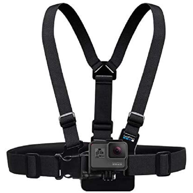 GoPro Chest Mount Harness for all GoPro cameras, featuring adjustable black straps and a secure quick-release mount. This camera harness is perfect for capturing immersive video and photos from a chest-level perspective during skiing, mountain biking, motocross, and paddle sports. Provides a lower-than-helmet view for engaging action camera footage.