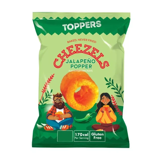 Toppers Cheezels Jalepeno Poppers 40g bag showing a large orange cheese-flavored corn puff with a green jalapeno pepper illustration beneath it, featuring two cartoon characters seated on green grass holding snacks, labeled baked never fried, gluten free, and 170 calories per serving, suitable as a spicy baked cheese snack.