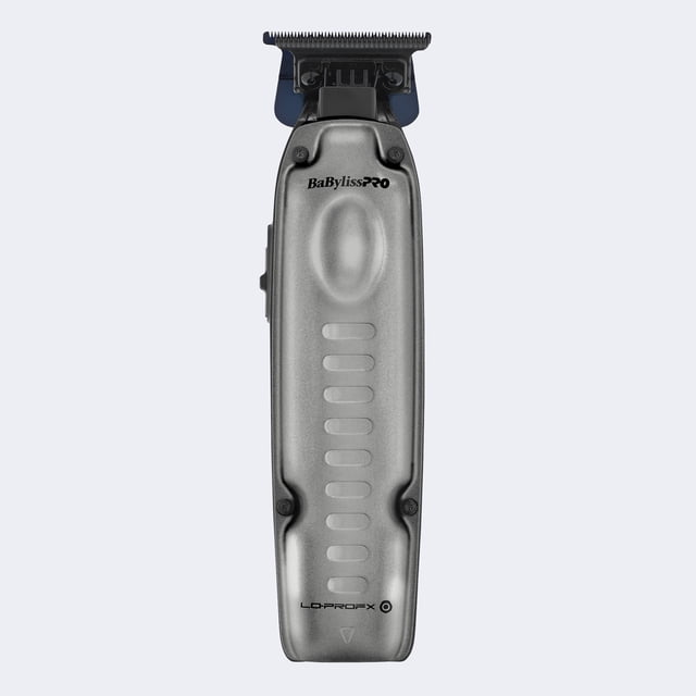 Babyliss Pro Trimmer FXONE LO PRO featuring a sleek, ergonomic design with a metallic finish. Equipped with a powerful N1 Brushless Motor operating at 7,200 RPM, a blue titanium standard-tooth T-blade, and an ultra-low-profile metal shield cover for precision grooming. Includes an interchangeable lithium-ion battery pack with up to 3 hours of runtime, a charging cord, base, lubricating oil, and brush. Designed for professional-grade grooming with zero-gap adjustability and dual voltage capability.