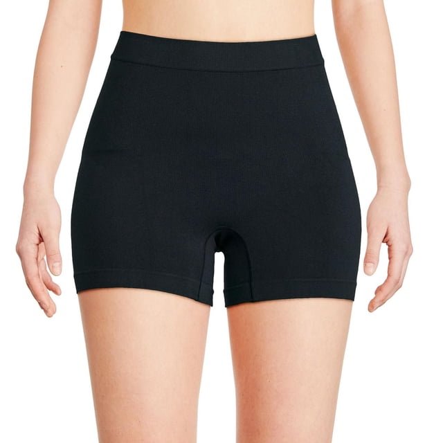 George Women's Shaper Boyshort 2-Pack in black shown front-facing on a model, seamless with an elasticized waistband, providing tummy, waist, hip, and thigh control and a stretch fit ideal for extra coverage under skirts and dresses.