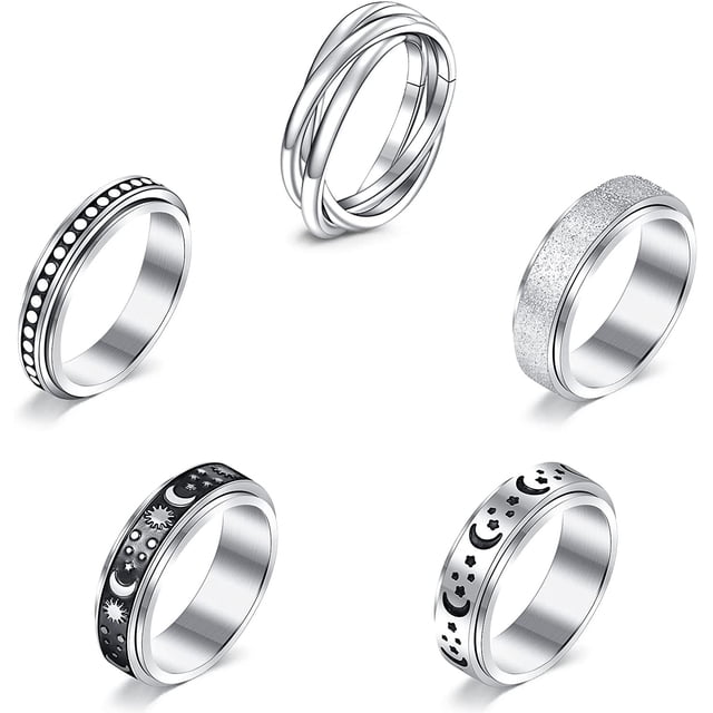 Anxiety Ring for Women Spinner Ring for Anxiety featuring a set of five silver-tone fidget rings. Each ring has a unique design, including a smooth interlocking band, a textured glitter finish, and engraved celestial patterns with stars and moons. Designed to help relieve stress and anxiety, these rings are suitable for both women and men.