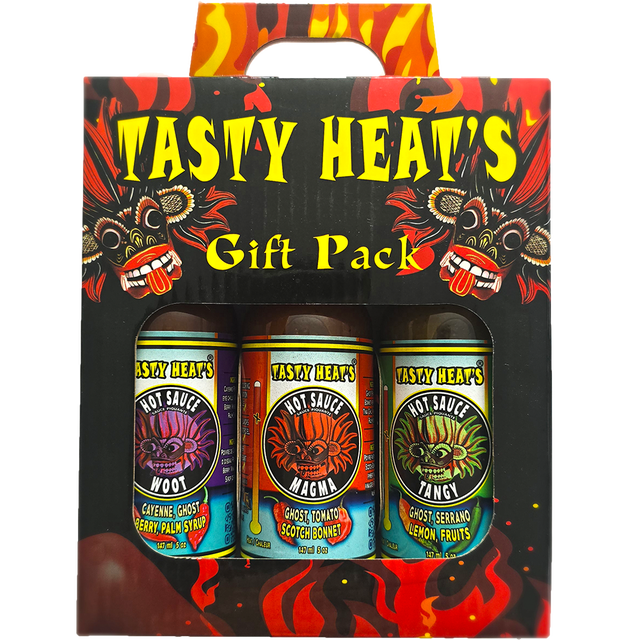 Tasty Heat's Hot Sauce Gift Set with three premium hot sauces labeled Woot, Magma, and Tangy, presented in a vibrant suitcase-style gift box featuring fiery graphics. Proudly Canadian, all-natural, gluten-free, vegan, dairy-free, and inspired by Sri Lankan flavors. Ideal for condiments and toppings.