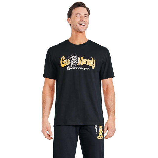 Gas Monkey Garage Men's Oversized Tee in black cotton-polyester jersey knit with crew neckline, short sleeves, dropped shoulders, and yellow-white front graphic logo, featuring a straight hem and oversized fit suitable for casual or lounge wear.