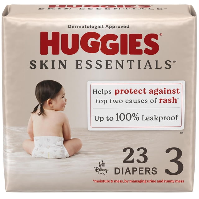 Huggies Skin Essentials Baby Diapers size 3, 23 count pack with a beige package featuring a baby wearing a diaper with Disney baby patterns, highlighting up to 100% leakproof protection and dermatologist-approved rash prevention by managing moisture and mess.