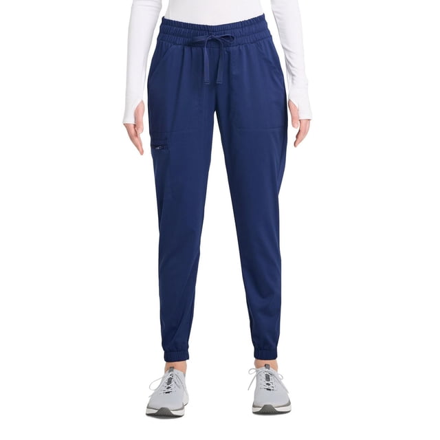 Scrubstar Pantalon de Sarrau Cargo Jogger à Cordon pour Femmes Ultimate Stretch WC047A en Bleu Marine avec Jambes Fuselées, Poignets Élastiques aux Chevilles, Taille à Cordon Ajustable et Cinq Poches Spacieuses, Dont une Poche Cargo Zippée, à Porter avec un Haut Blanc à Manches Longues et des Espadrilles Grises, Idéal pour un Confort Toute la Journée en Soins de Santé Ou en Milieux de Travail.