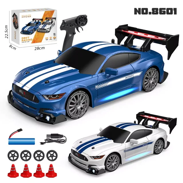 AIGIA 30KM/H RC Drift Car 1/24 2.4GHz 4WD Remote Control Sport Racing On-Road Vehicle featuring a blue and white PVC body shell with racing stripes, bright LED headlights, and a large rear spoiler. Includes a 2.4GHz remote control, four drift wheels, four roadblocks, a 3.7V-500mAh lithium battery, a charging cable, and a screwdriver. The car is capable of speeds up to 30km/h, with a control range of over 50 meters, and offers forward, backward, braking, and turning functions. Suitable for racing and drifting on various terrains.