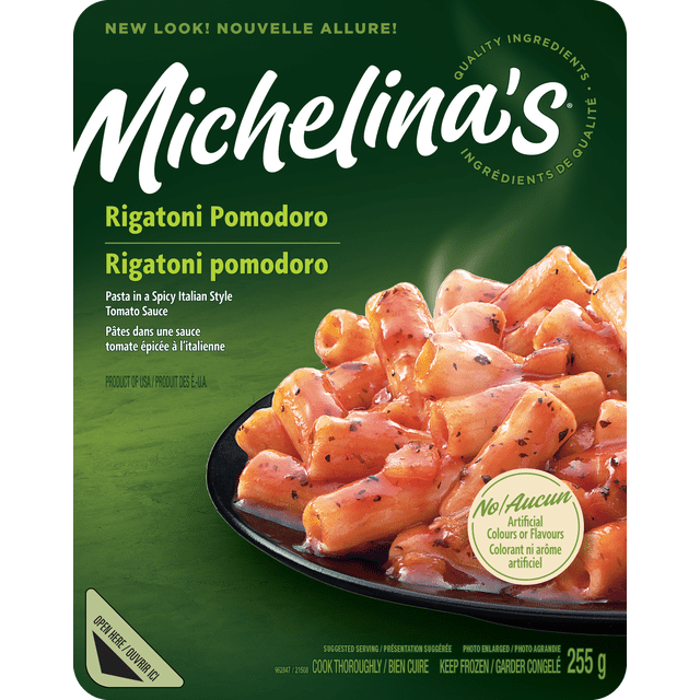 Michelina's Rigatoni Pomodoro Pasta shows rigatoni pasta tubes coated in a spicy Italian style tomato sauce with herbs on a black plate with steam, packaged in a 255 g container with bilingual English and French text on a green background, ideal for quick Italian meals.
