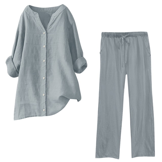 Timegard Womens 2 Piece Plus Size Lounge Sets in solid grey, including a long sleeve notched V-neck button-down top and drawstring pants. Made of 95% polyester and 5% spandex for a soft, lightweight feel, perfect for lounging or casual wear. The loose-fitting design offers versatility, allowing the pieces to be worn separately or together. Ideal as a comfortable plus size outfit for fall and winter.